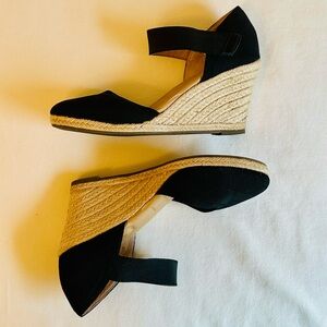 Black espadrille wedges with natural jute rope trim, cushioned soles